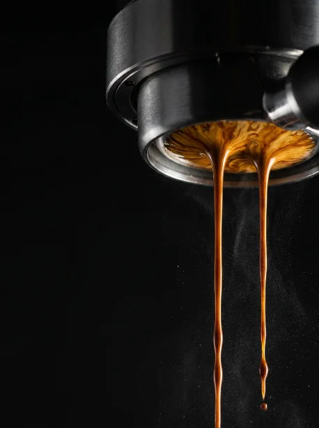 Espresso extracting through a naked portafilter